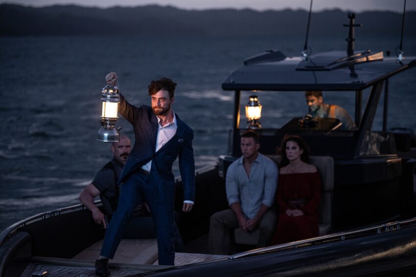 Daniel Radcliffe on a boat in The Lost City