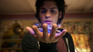 Jaime Reyes holding the Scarab in Blue Beetle