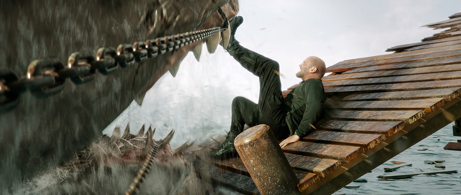Jason Statham kicking a giant shark in Meg 2: The Trench