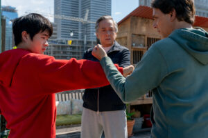 Ben Wang, Jackie Chan, and Ralph Macchio in Karate Kid: Legends