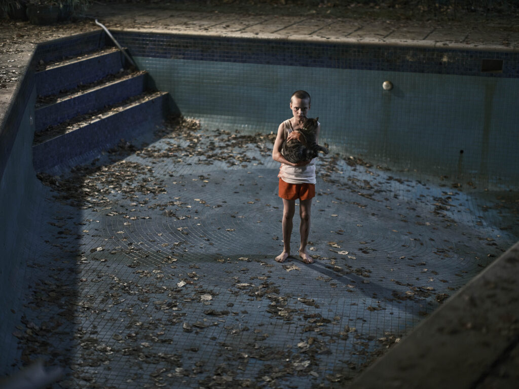 Child standing in an empty pool in 'Bring Her Back' from Columbia Pictures