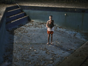 Child standing in an empty pool in 'Bring Her Back' from Columbia Pictures