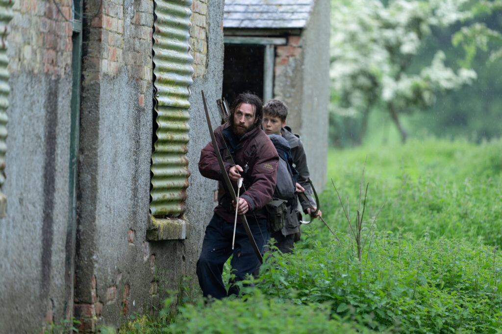 Aaron Taylor-Johnson and Alfie Williams on a hunt in the woods
