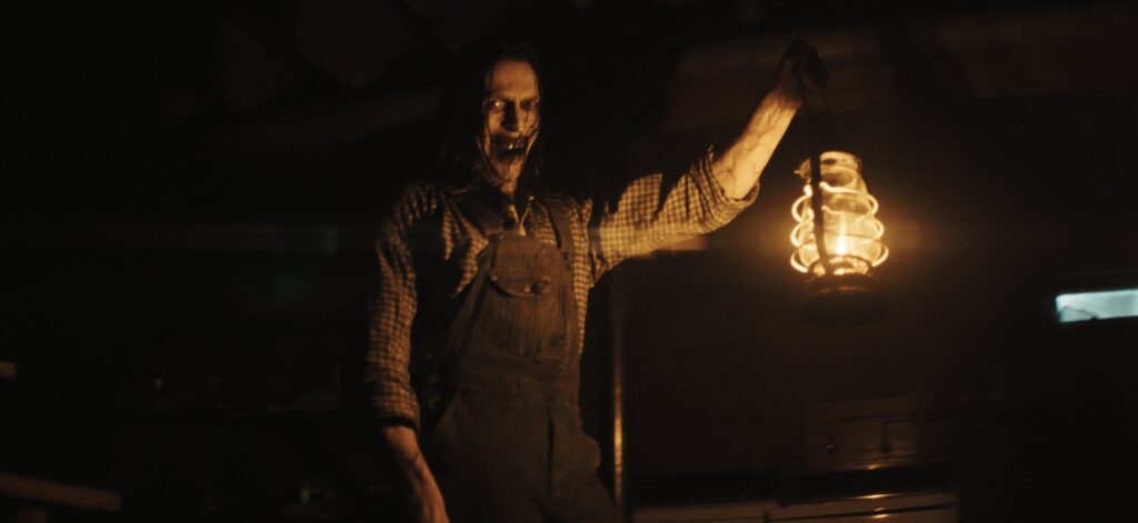 Monster holding a lamp in The Conjuring: Last Rites