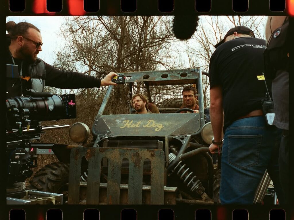 Glen Powell behind the scenes of The Running Man