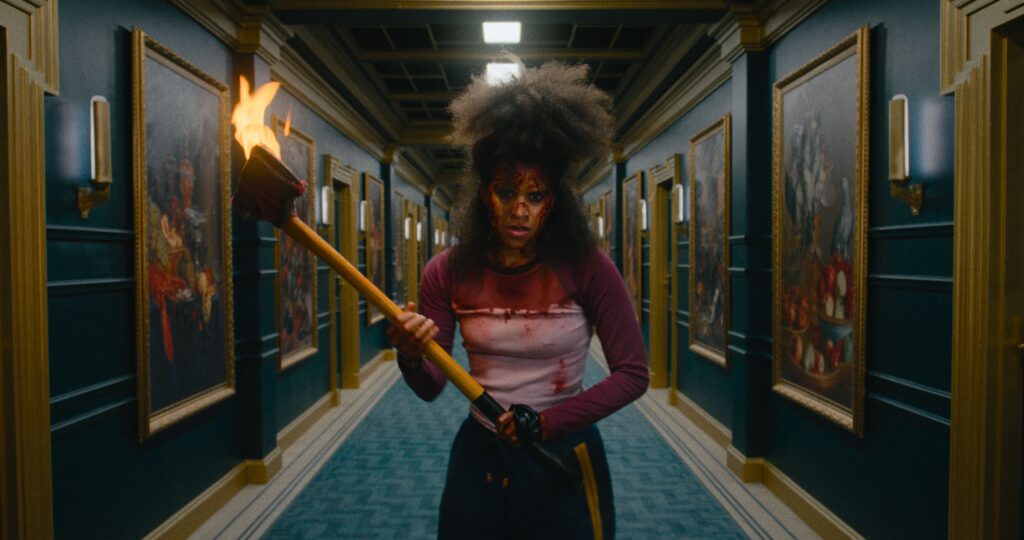 Zazie Beetz carrying an ax in They Will Kill You 